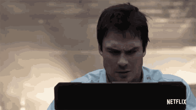 a man is looking at a netflix advertisement