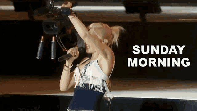a woman singing into a microphone with the words " sunday morning " above her