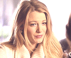 a close up of a woman 's face with the letter c visible in the corner