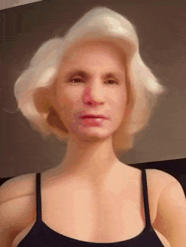 a mannequin with blonde hair and a black top