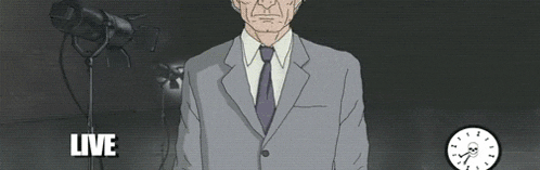 a man in a suit and tie is standing in front of a clock that says " live "
