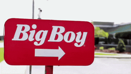 a big boy sign with a white arrow pointing to the right