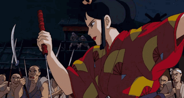 a woman in a red and yellow kimono is holding a red stick