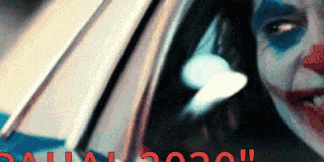a close up of a clown looking out of a car window with the words " dallas 2020 " below him