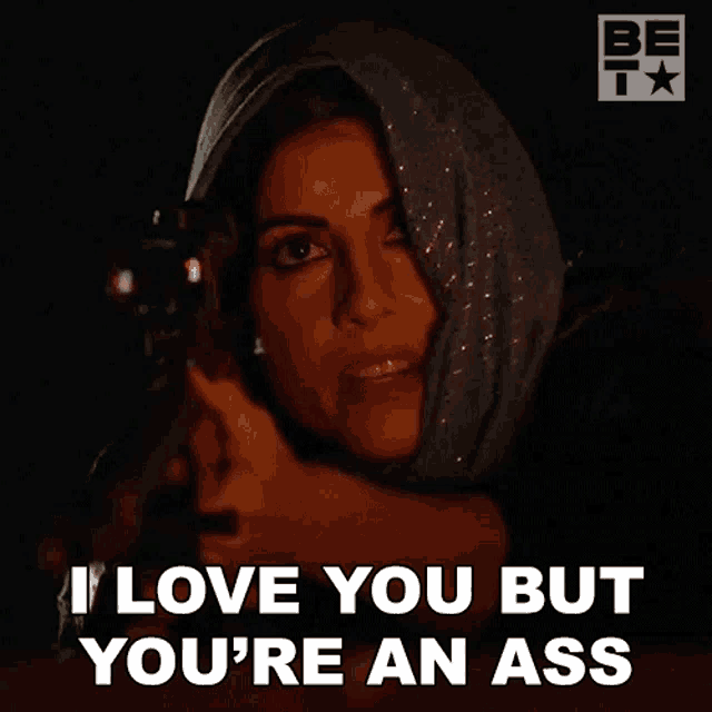 a woman holding a gun with the words i love you but you 're an ass