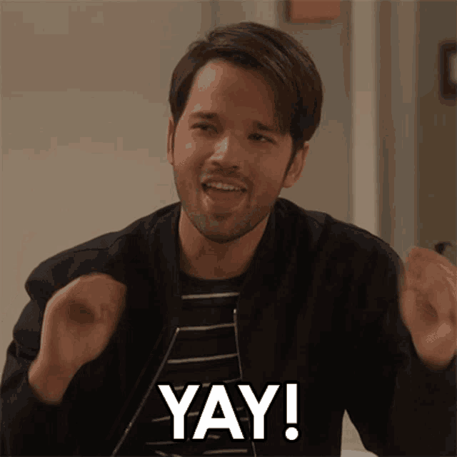 a man with a beard is making a funny face and saying yay