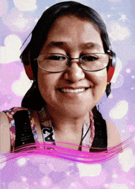 a woman wearing headphones and a lanyard that says a2 on it