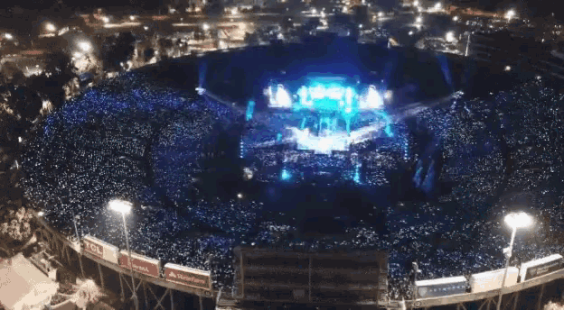 an aerial view of a stadium full of people with a sign that says tcl on it