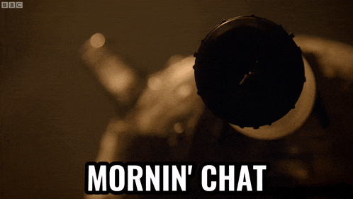 a close up of a camera lens with the words mornin ' chat on the bottom