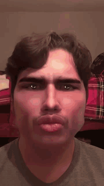 a close up of a man 's face with his eyes closed