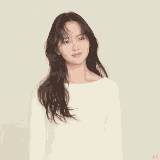 a woman with long hair is wearing a white shirt with the word jete on the bottom
