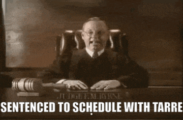 a judge sitting at a desk with the words sentenced to schedule with tarre written below him