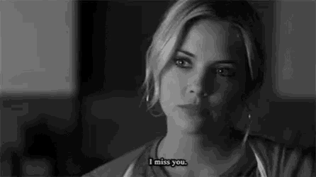a black and white photo of a woman talking about missing someone .