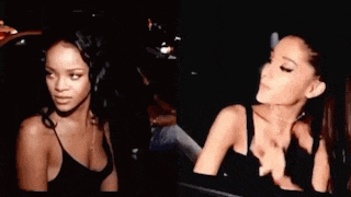 rihanna and ariana grande are standing next to each other in the dark .