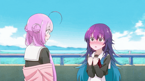 a girl with purple hair and a pink haired girl are standing next to each other