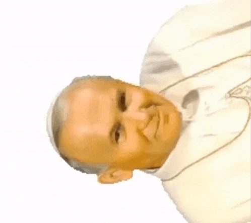 a man with a cross around his neck is smiling