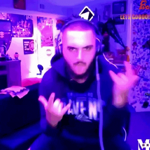 a man wearing headphones and a blue shirt that says wave n.