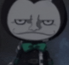 a close up of a cartoon character wearing a green bow tie and making an angry face .