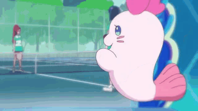 a pink seal is standing on a tennis court looking at a girl playing tennis .