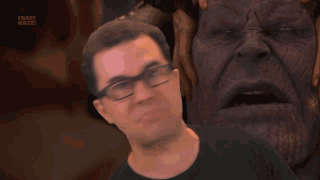 a man with glasses and a black shirt with the words crazy mate on the bottom