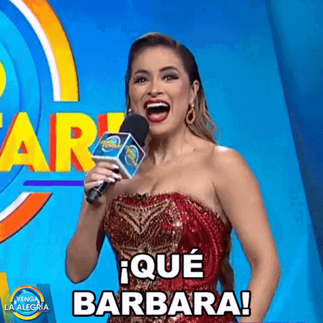 a woman is holding a microphone and says barbara
