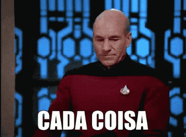 a bald man in a red sweater says " cada coisa "