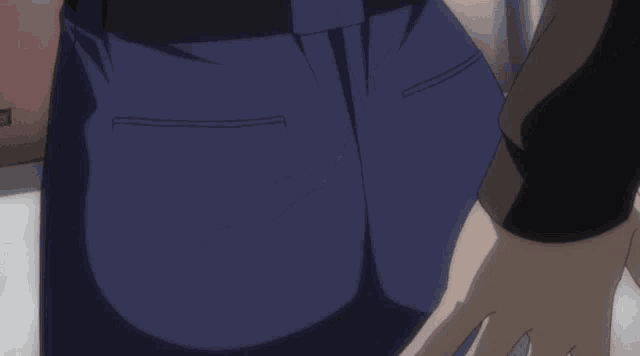a close up of a person 's back with a hand on it