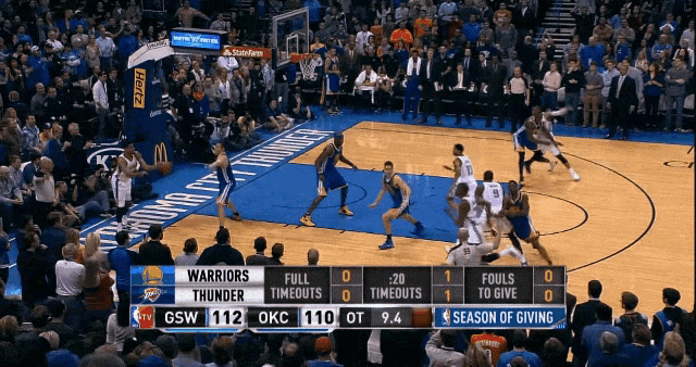 a basketball game is being played between the warriors and thunder