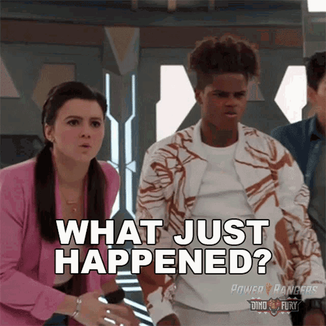 a group of power rangers are standing next to each other and one of them is saying what just happened