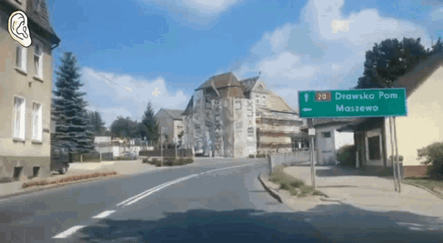 a green street sign says drawsko pom massewo on it