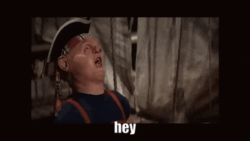 a man in a pirate hat is saying hey you fuckerrr .