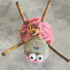 a close up of a cupcake with pink frosting