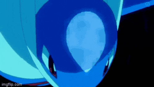 a close up of a blue object with a light coming out of it in a dark room .