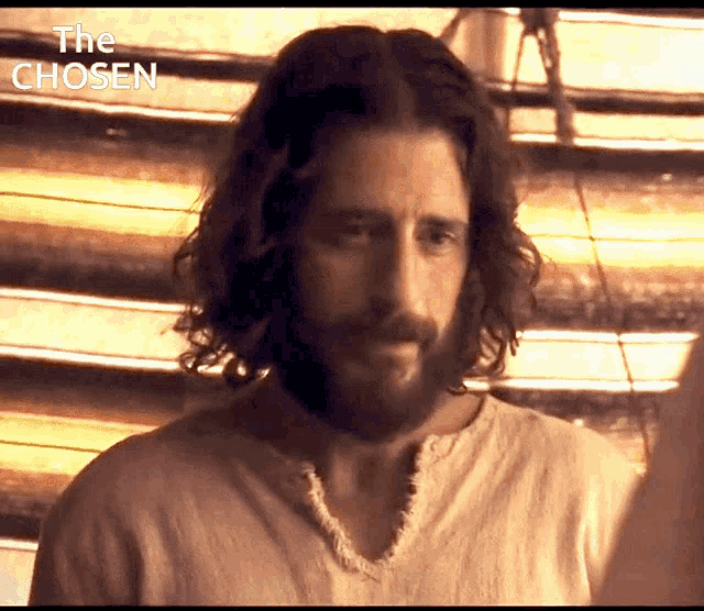 a man with long hair and a beard is shown in a scene from the chosen