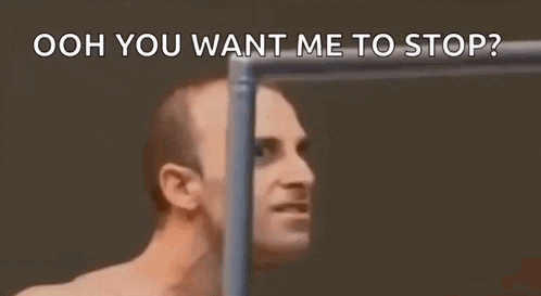 a man without a shirt is standing in front of a wall and says `` ooh you want me to stop '' .