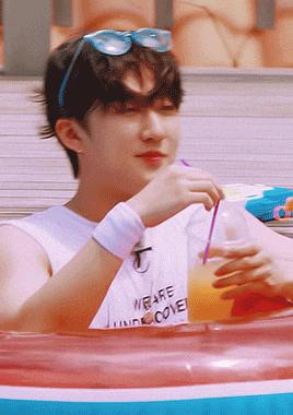 a young man wearing sunglasses and a shirt that says we are undercover drinks from a plastic cup
