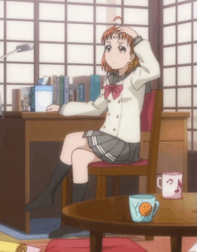 a girl in a school uniform sits in a chair with her hand on her head