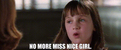 a little girl is talking to a woman and the words `` no more miss nice girl '' are visible .