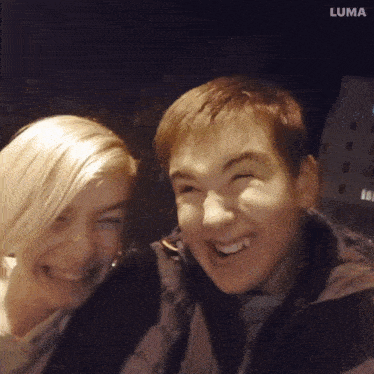a boy and a girl are posing for a picture with the word luma in the corner