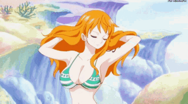 a woman in a bikini stands in front of a waterfall