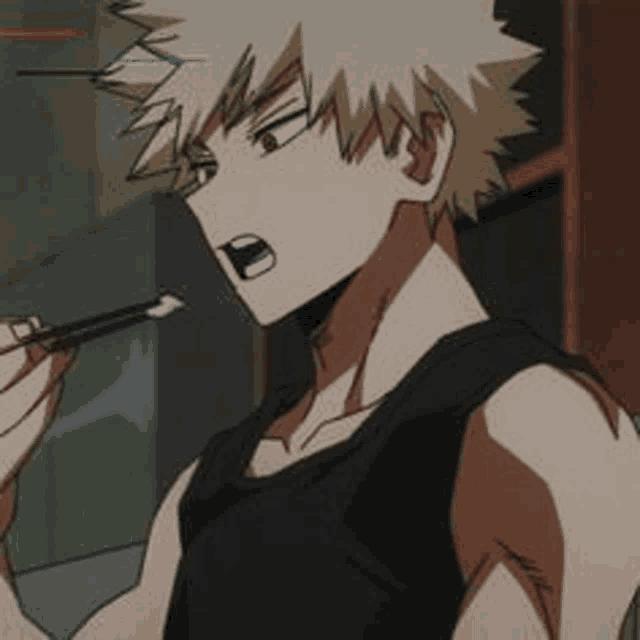 a man in a black tank top is brushing his teeth with a pair of chopsticks .
