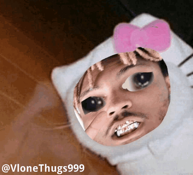 a picture of a man wearing a hello kitty face mask
