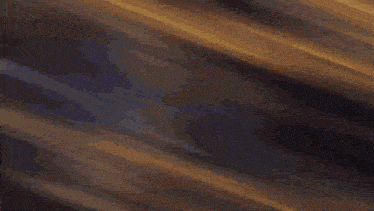 a blurred image of a dark room with a few lights on