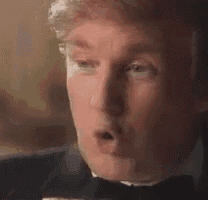 a man in a tuxedo is eating a slice of pizza .