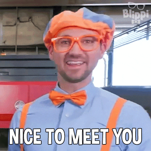 a man in a clown costume is smiling and says nice to meet you