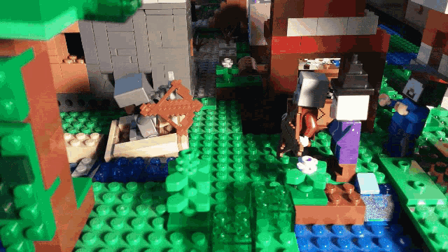 a lego model of a minecraft scene with a few buildings