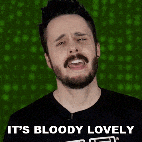 a man with a beard is wearing a black shirt that says it 's bloody lovely on it