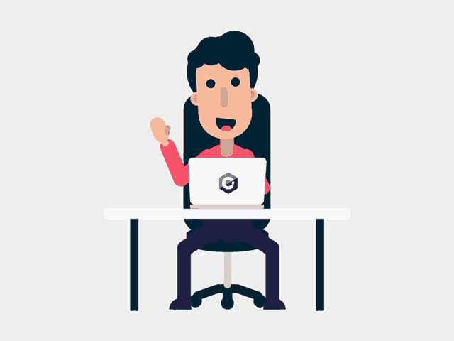a man is sitting at a desk with a laptop with the letter c on the screen