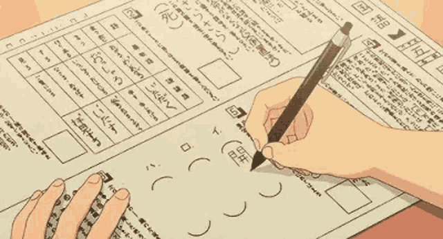 a person is writing on a piece of paper with a pencil on it .