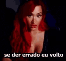 a woman with red hair is smiling with the words e donato 500 reais above her